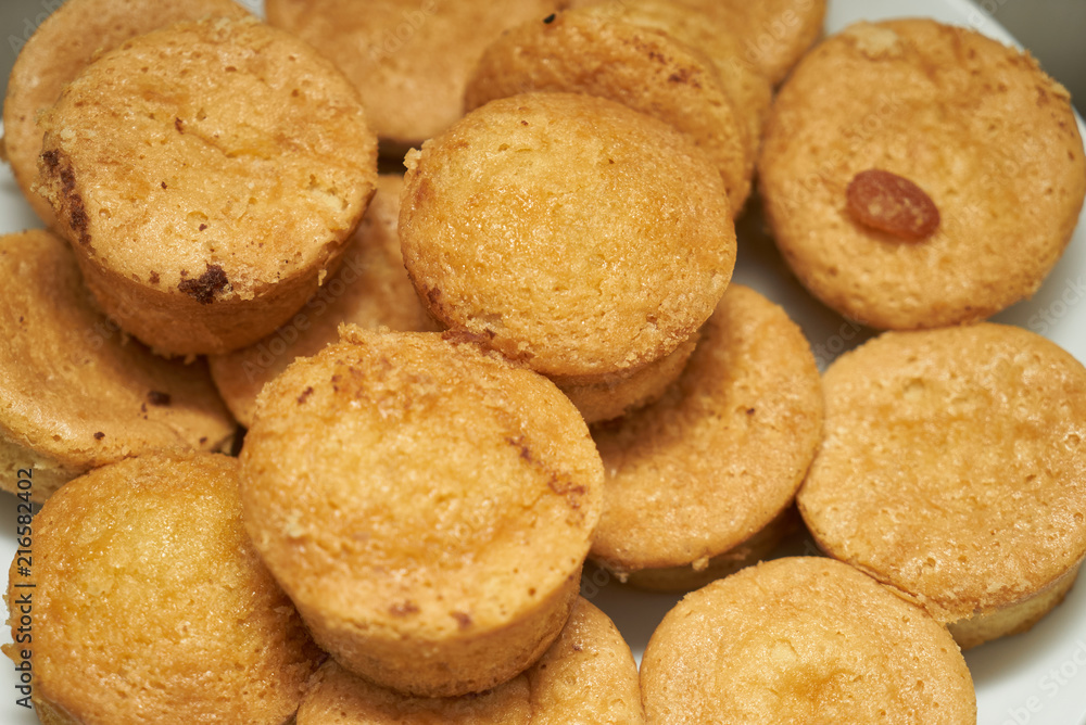 Cookies and sweet biscuits on white plate background, top view 