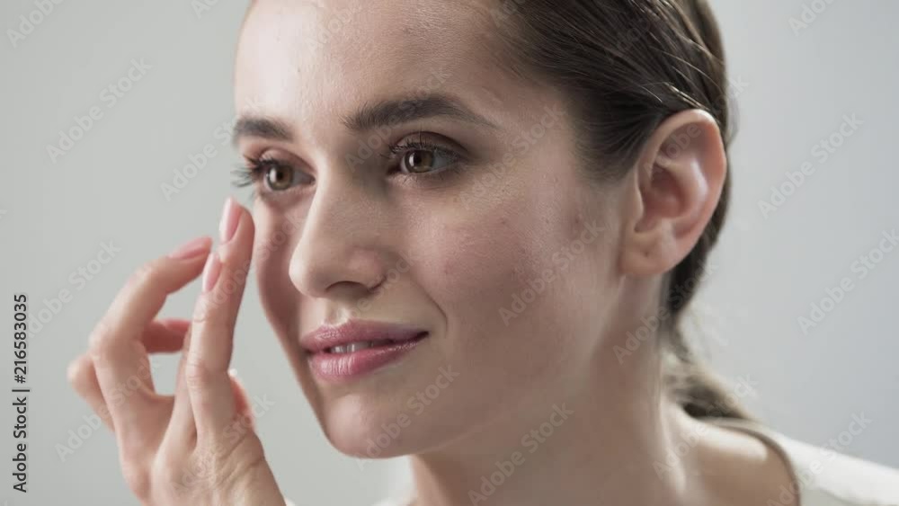 Face Skin Care. Woman Touching Skin Under Eyes Closeup Face Skin Care. Woman Touching Skin Under Eyes Closeup
