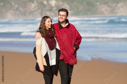Couple Walking on the Beach in Winter © Craig
