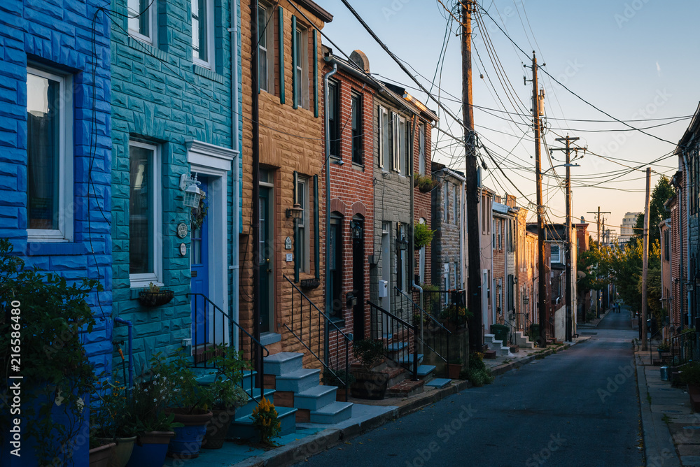 Colorful row houses along Chapel Street in Butchers Hill, Baltimore, Maryland.