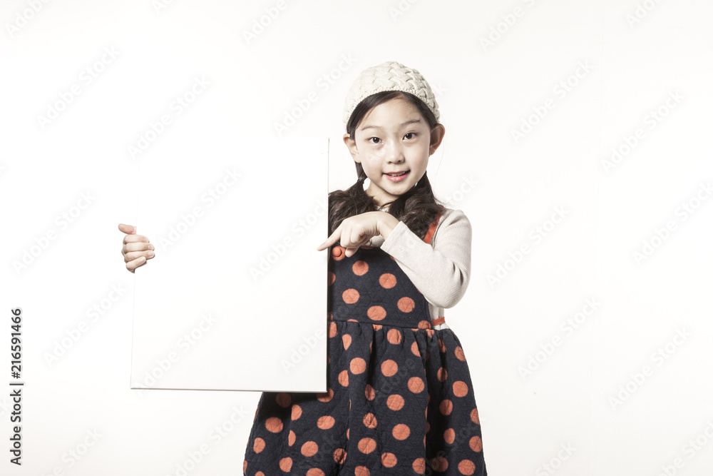 A girl hand hold a white board isolated white. A girl hand hold a white board isolated white.