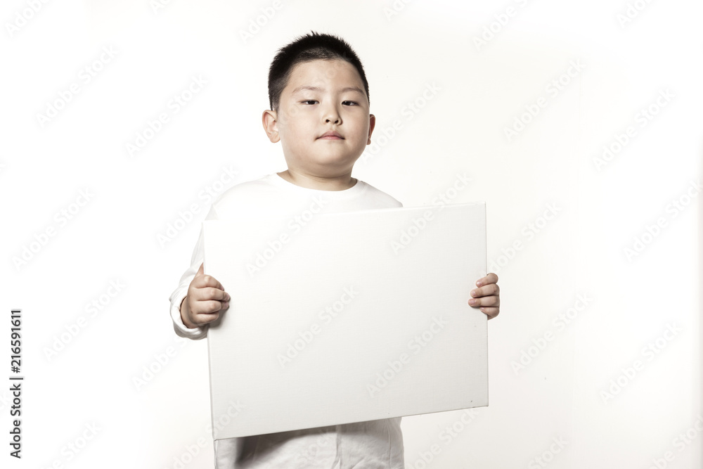 A boy hand hold a empty white board isolated white. A boy hand hold a empty white board isolated white.