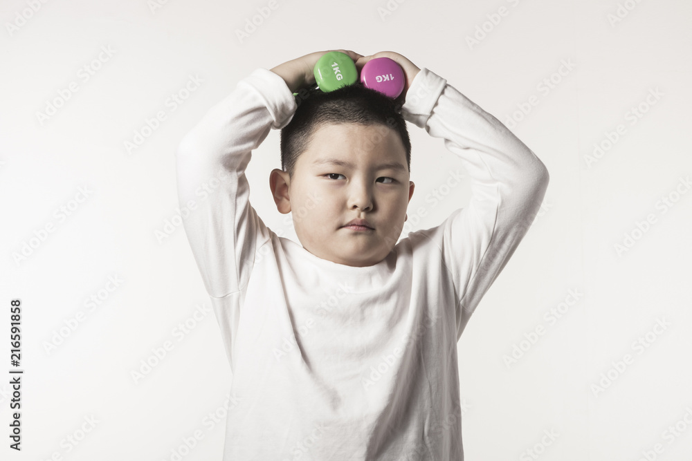 boy hand hold a dumbbell isolated white. boy hand hold a dumbbell isolated white.