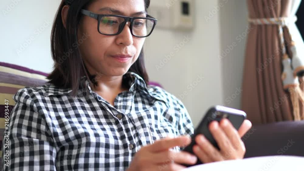 Young woman taking off glasses tired of mobile phone work, Suffering from eye strain tension or blurry vision problem concept Young woman taking off glasses tired of mobile phone work, Suffering from eye strain tension or blurry vision problem concept
