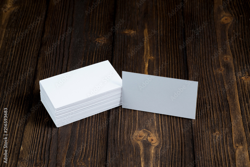 Blank business cards on wooden working table with copy space for add text ID. and logo, business company concept. Blank business cards on wooden working table with copy space for add text ID. and logo, business company concept.