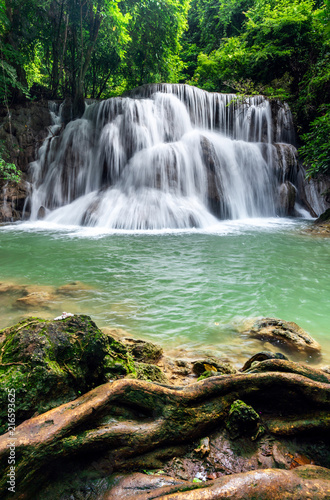 Fototapeta Naklejka Na Ścianę i Meble -  Beautiful waterfall in tropical rainforest at Kanchanaburi province, Thailand