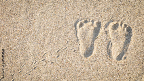 The little cute footprint of baby on the sand.