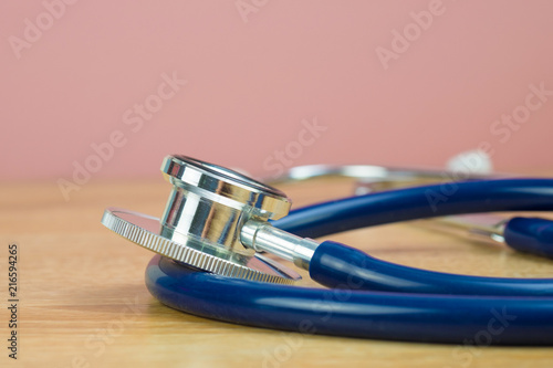 Stethoscope with blue tube on table, health and medical concept.