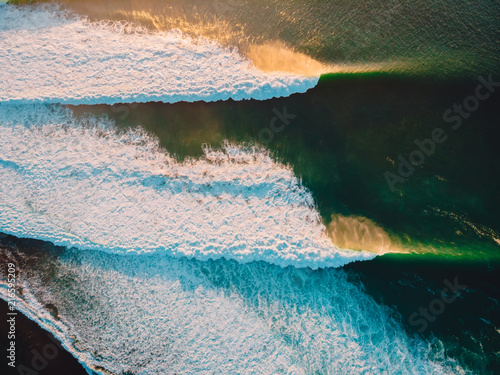 Photography Aerial shooting of stormy waves at sunset. Biggest ocean wave