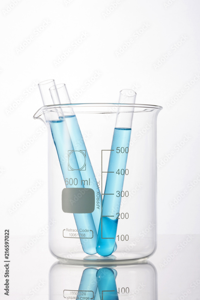 beaker and cylinder closeup isolated white. beaker and cylinder closeup isolated white.