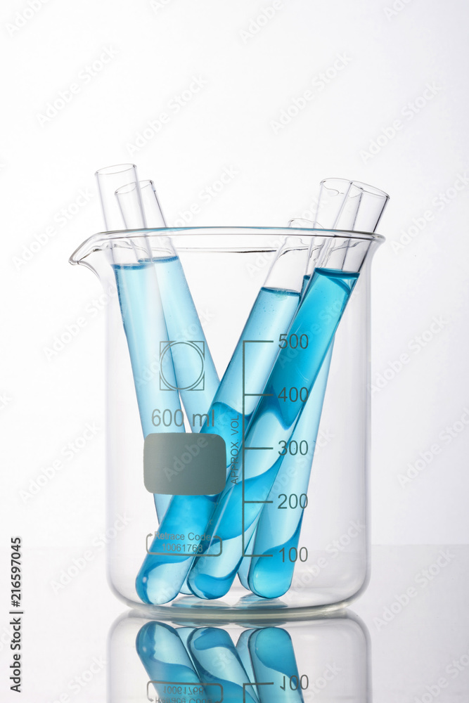beaker and cylinder closeup isolated white. beaker and cylinder closeup isolated white.