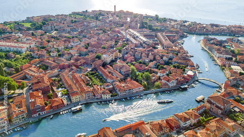 Fotografiet Aerial view of Murano island in Venetian lagoon sea from above, Italy