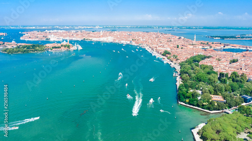 Aerial view of Venetian lagoon and cityscape of Venice island in sea from above, Italy
 photo