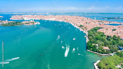 Aerial view of Venetian lagoon and cityscape of Venice island in sea from above, Italy
