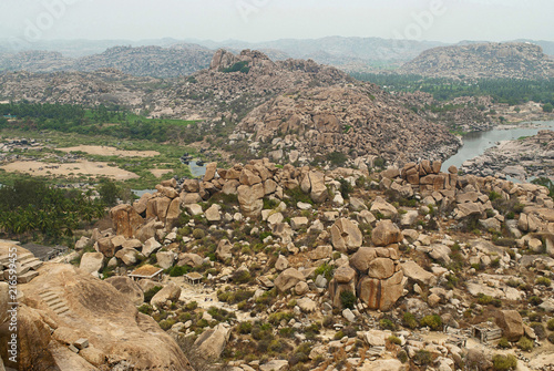 Arieal view of the chain of hills of Hampi from north side of Matanga Hill, Hampi, Karnataka. Sacred Center. The Anjeneya Hill is seen in the distance. photo