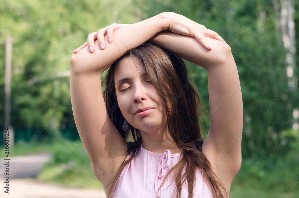 Young pensive woman posing in the forest. Young pensive woman posing in the forest.