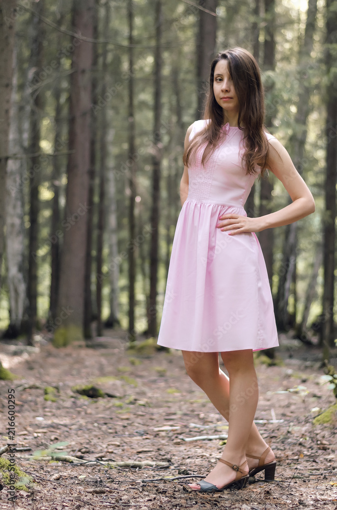 Young happy woman posing in the forest. Young happy woman posing in the forest.