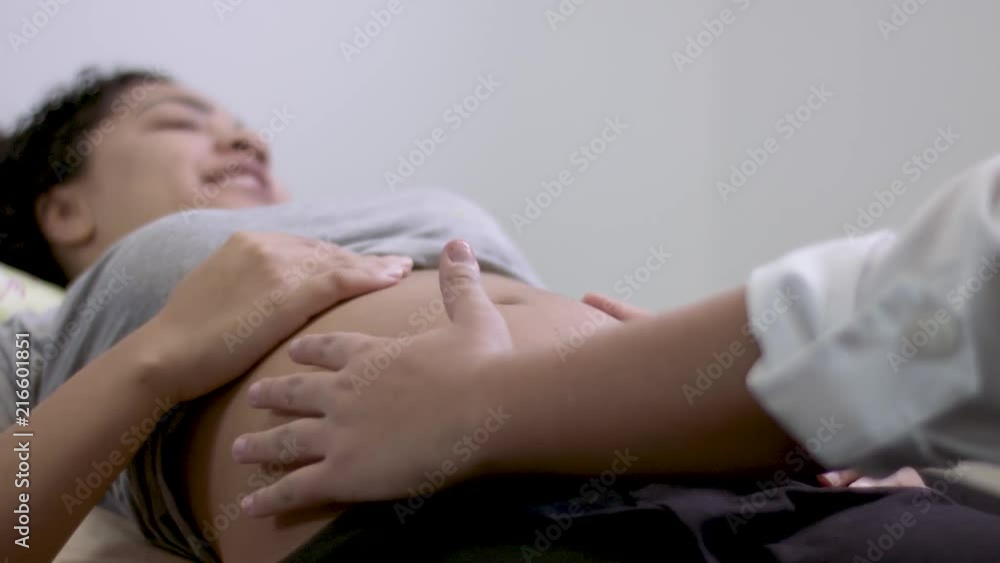 Pregnant woman having a massage. Pregnant woman having a massage.