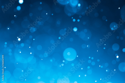 Dark blue abstract backgrounds with bokeh.