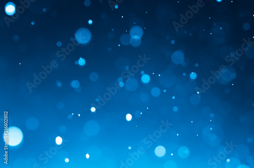 Dark blue abstract backgrounds with bokeh.