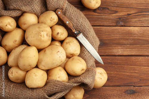 Pile of potatoes lying on wooden boards