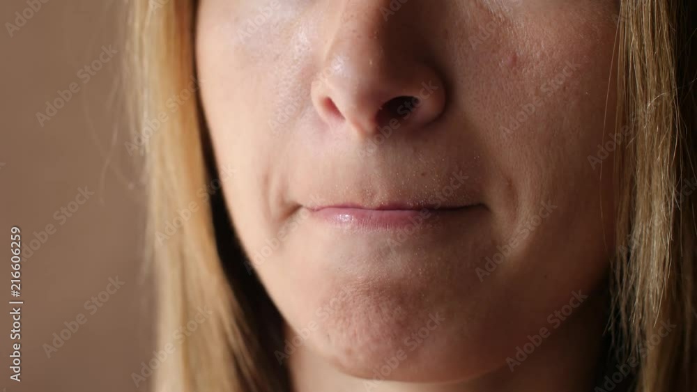 Women's lip ulcers herpes closeup. Beautiful lips were covered with cold sores. The girl licks her lips covered with herpes. Women's lip ulcers herpes closeup. Beautiful lips were covered with cold sores. The girl licks her lips covered with herpes.
