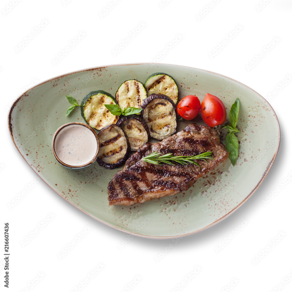 Steak with grilled vegetables, isolated on white background, view from above