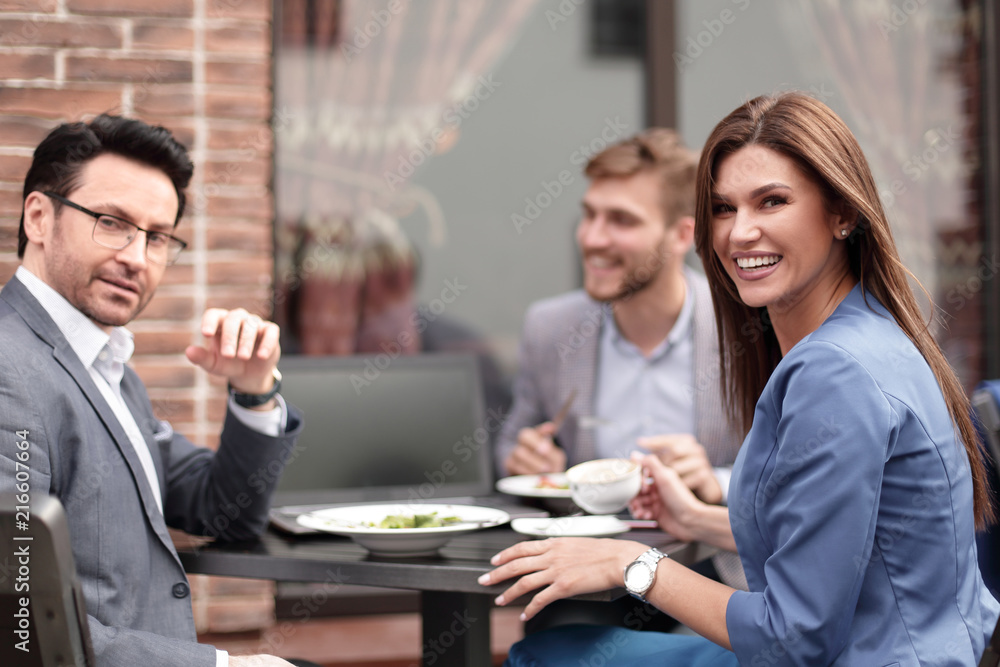 close up.business team sitting at a table in a cafe