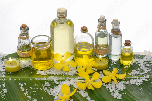 Spa setting on banana leaf with yellow orchid  candle pile of salt