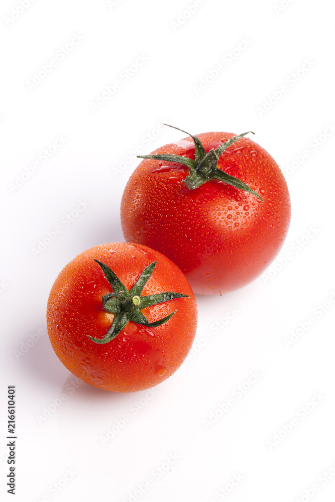 red tomato on the white background. red tomato on the white background.