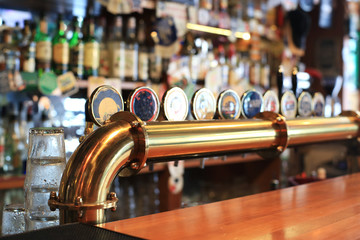 Fotobehang Kroeg Klassieke bar met biertaps  © Zarya Maxim
