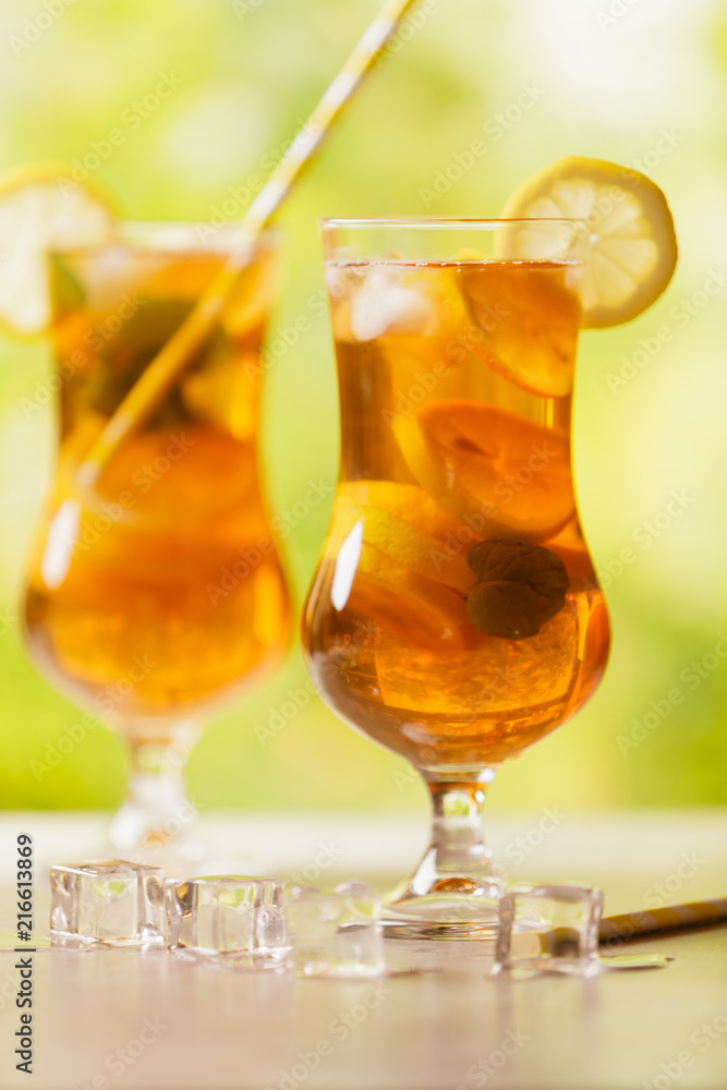 Iced tea with lemon and ice cubes Iced tea with lemon and ice cubes