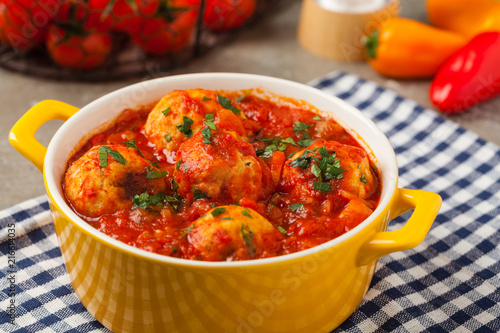 Chicken meatballs with tomato sauce. Served with rice.