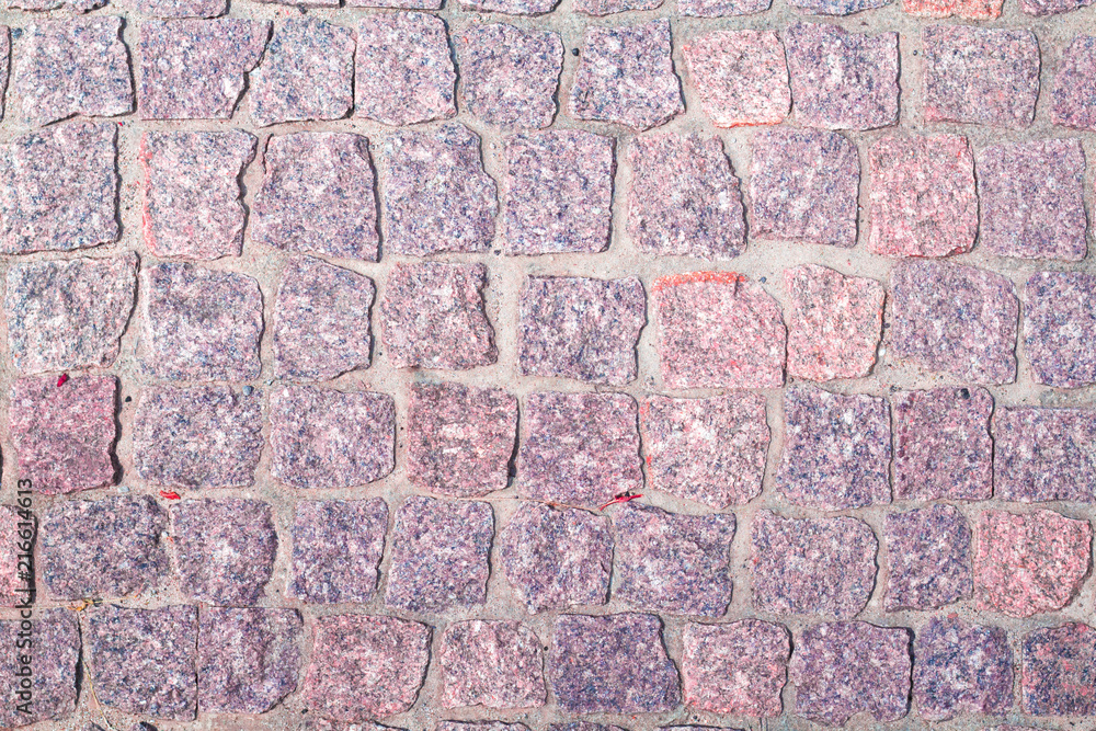 Obraz premium fragment of granite pavers in different color schemes