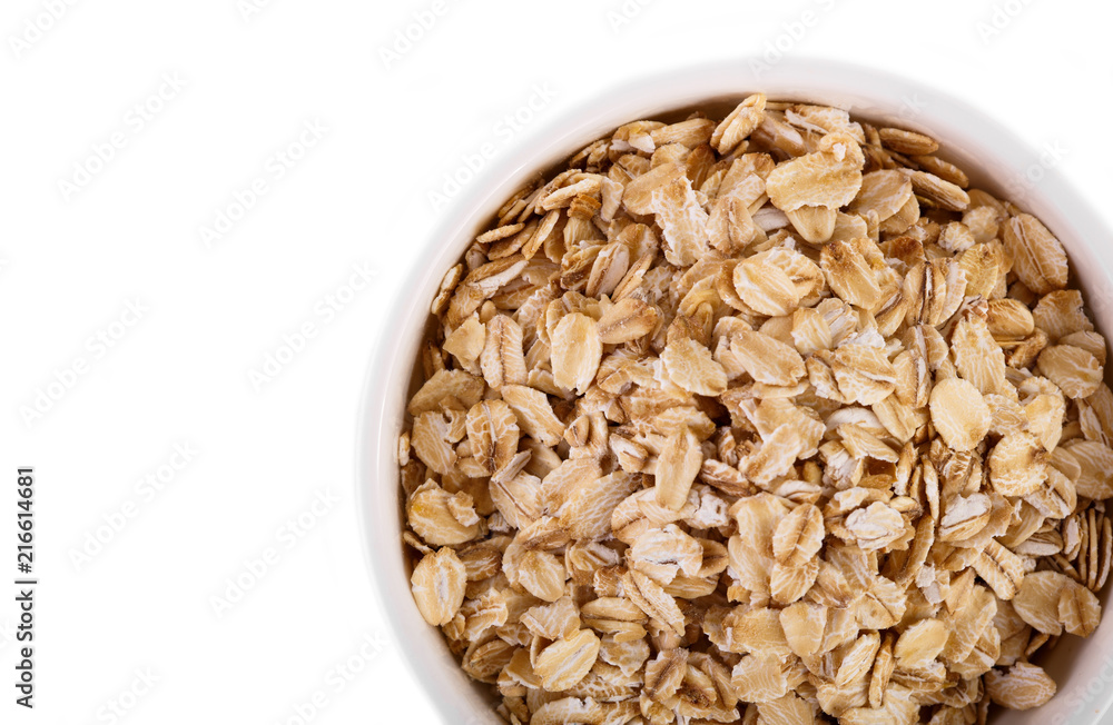 pile of oatmeal isolated on white background. Creative layout made of organic oatmeal isolated on white background. Food concept. pile of oatmeal isolated on white background. Creative layout made of organic oatmeal isolated on white background. Food concept.