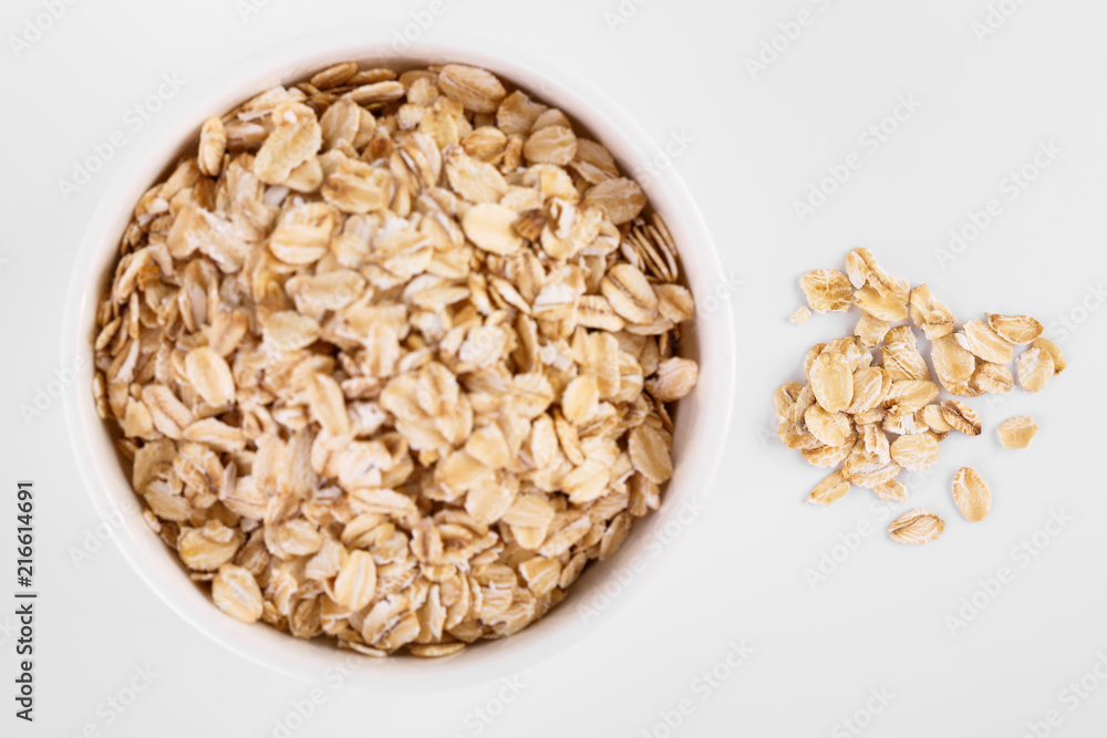 pile of oatmeal isolated on white background. Creative layout made of organic oatmeal isolated on white background. Food concept. pile of oatmeal isolated on white background. Creative layout made of organic oatmeal isolated on white background. Food concept.