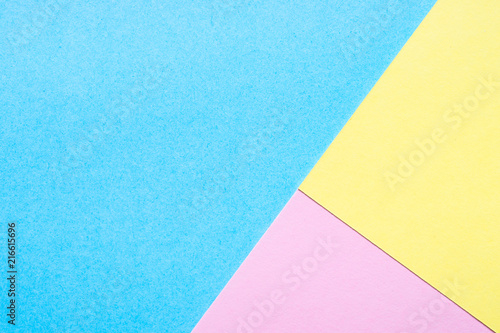Blue, yellow and pink paper background. 