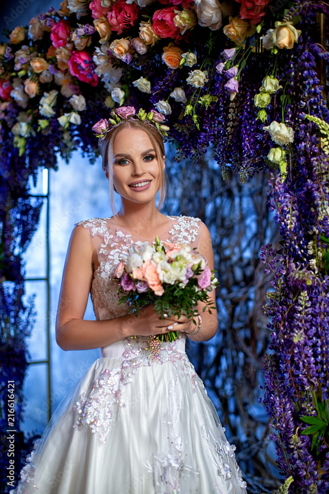 Beautiful bride in wedding white dress with flowers Beautiful bride in wedding white dress with flowers