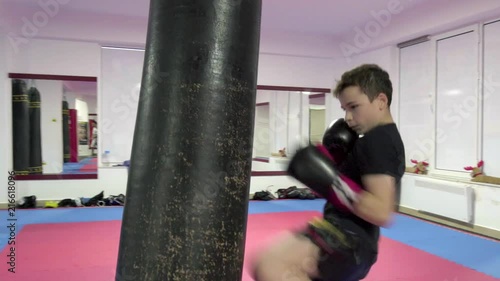Kickboxer training with the heavy bag