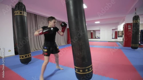 Kickboxer training with the heavy bag