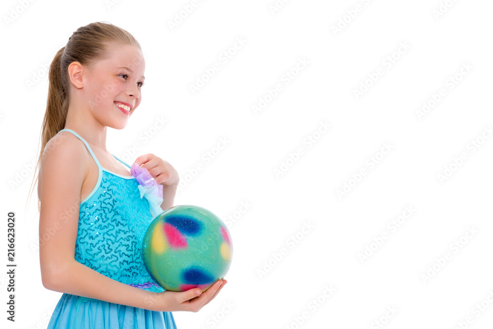 Girl gymnast performs exercises with the ball. Girl gymnast performs exercises with the ball.