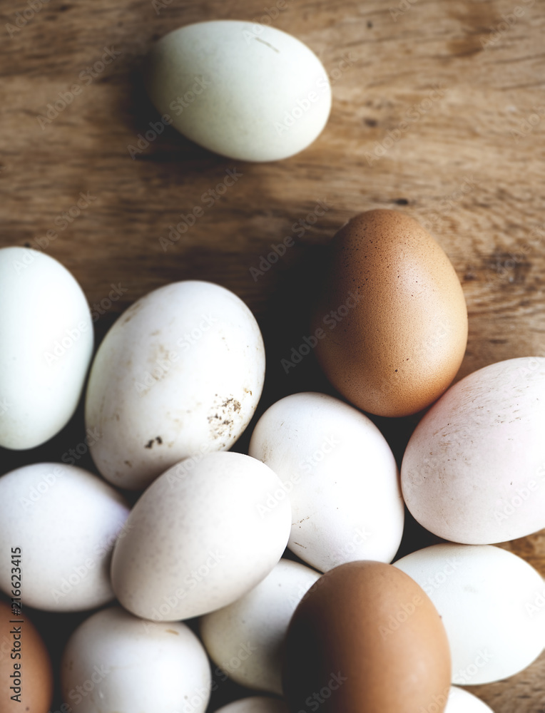Chicken and duck eggs on wooden floor Chicken and duck eggs on wooden floor
