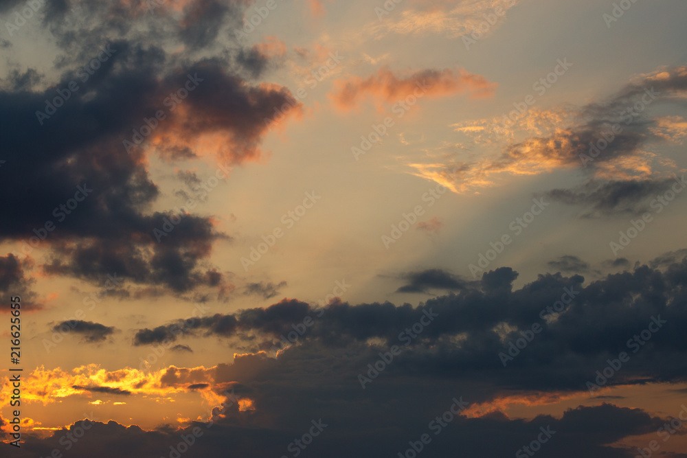 Beautiful sunset in the sky. Beautiful colorful clouds. The sky in the clouds