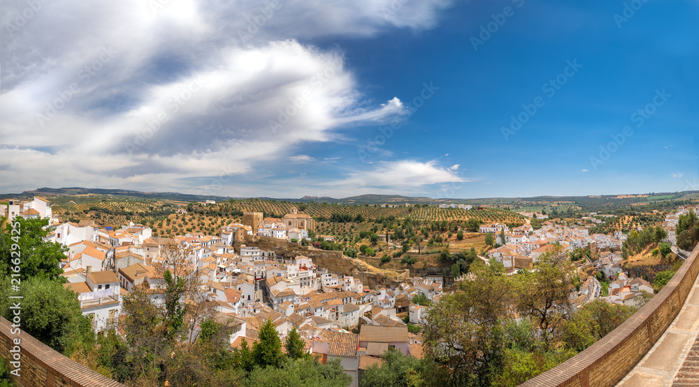 Panorama view of Setenil de las Bodegas in Spain, famous for its houses built in caves into rock overhangs above the Rio Trejo