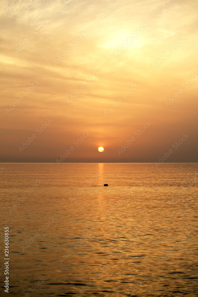 The sea the morning  amidst the clouds and the sky is beautiful quiet atmosphere feeling lonely