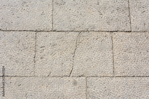 background cobbles of light-colored stone with a crack down the middle