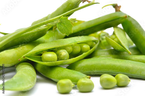 Pods of green peas isolated on a white background. Green, ripe, fresh vegetables. Legumes.