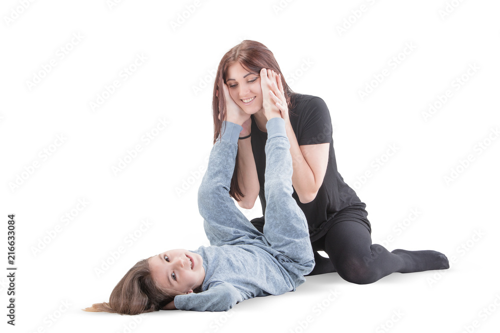 © Vitte Yevhen - Loving mother and her daughter child girl playing and hugging on white background. Concept of happy. Studio shoot