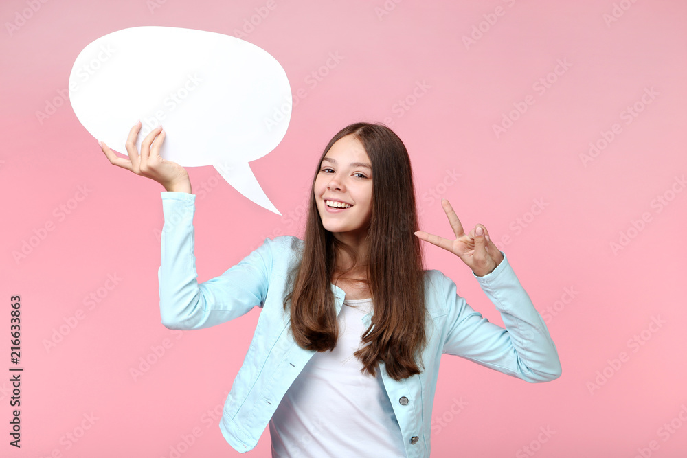 Young girl with speech bubble on pink background Young girl with speech bubble on pink background