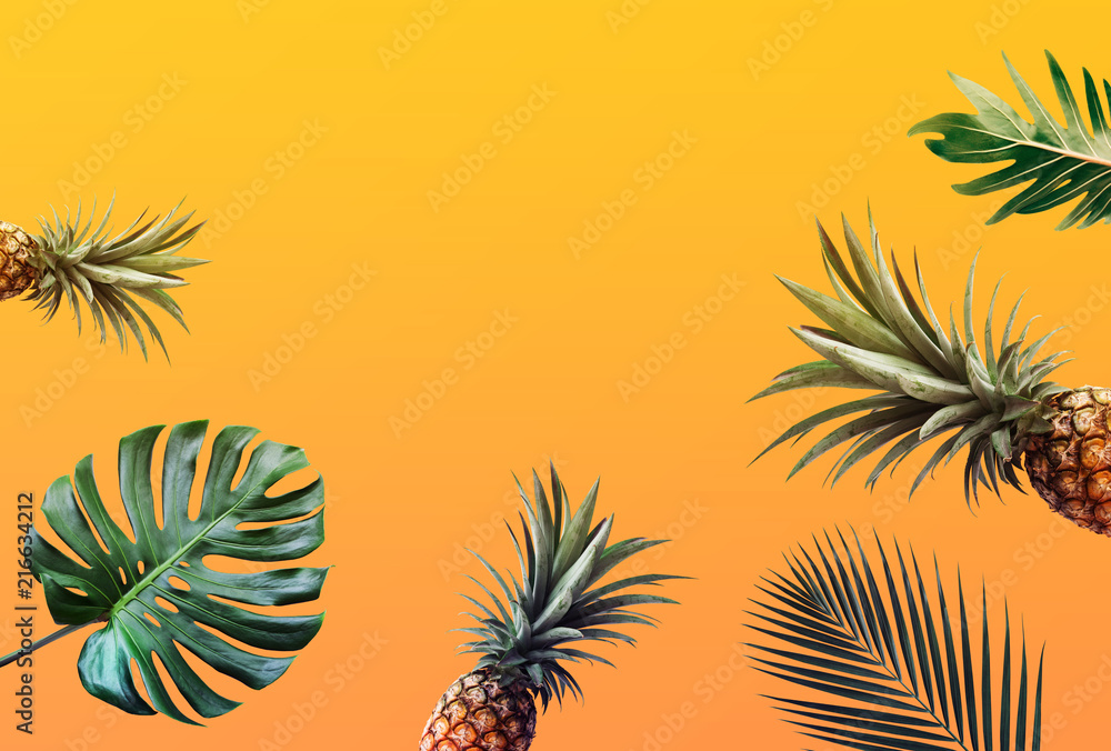 Tropical leaves pattern with pineapple color background.Nature and holiday summer concepts